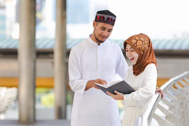 muslim-couple-muslim-couple-young-girl-boy-reading-book-shopping-city-concept-education-shopping